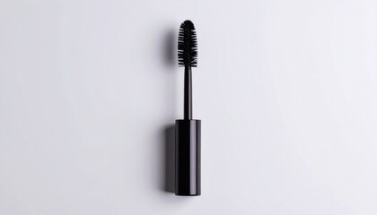 Isolated black mascara brush on a clean white background, centered vertically