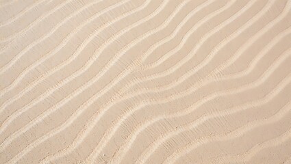 Fototapeta premium Textured sand dune surface featuring waves of light and shadow showing natural erosion