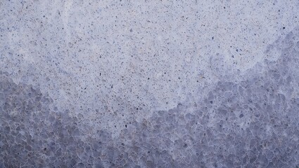 Obraz premium Abstract textured background with a gradient of icy blue tones and granular texture.