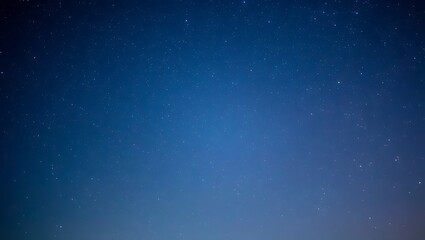 Obraz premium Beautiful night sky filled with stars in a deep blue atmospheric background