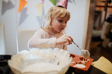 Sibling celebration with cupcakes and fun at a family gathering in the kitchen