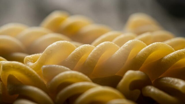 Close-up of steaming cooked fusilli pasta