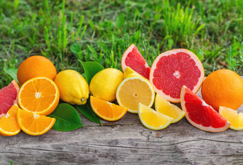 different citrus fruits sliced background. Selective focus.