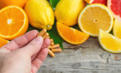 citrus essential oil in a bottle. Selective focus.