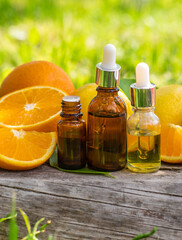citrus essential oil in a bottle. Selective focus.