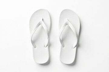 Pair of white flip-flops, isolated white backdrop, soles, thongs, isolated