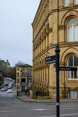 Street Scene with Historic Architecture and Directional Signpost in Batley