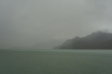 USA, Alaska, Glacier Bay National Park and Preserve - cruise ship leaving protected seascape...