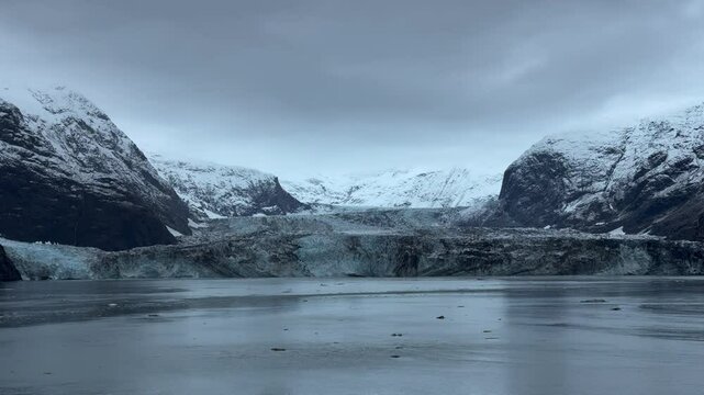 USA, Alaska, Glacier Bay National Park and Preserve, Johns Hopkins Inlet - cruise ship slowly turning in front of massive claving tidewater glaciers of the Fairweather Range