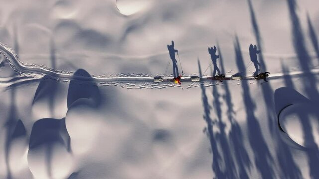 Explorers pulling sleds across snowy landscape