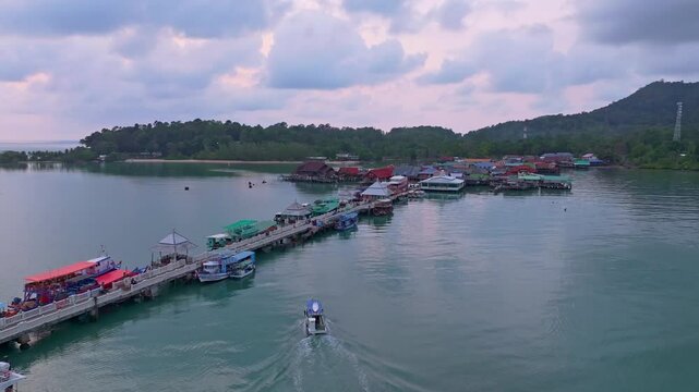 Tranquil floating homes and fishing boats near Bang Bao Pier, Thailand. Aerial drone video