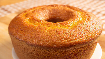 Cake, details of a delicious cake on a table with a tablecloth, selective focus.