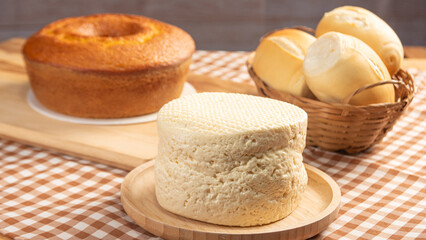Breakfast table, beautiful breakfast table in Brazil with cake, cheese breads and more, on table with tablecloth, selective focus.