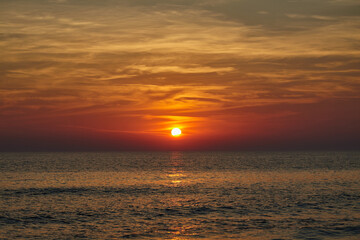 Fototapeta premium majestic sunset on the sea. warm summer evening