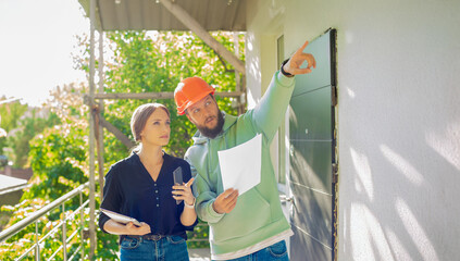 architect and foreman engineer at a construction site