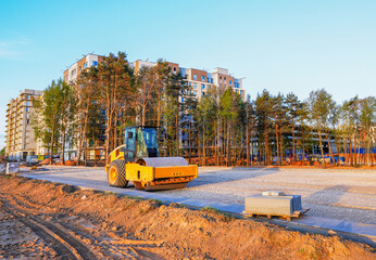 Soil Compactor for leveling ground on parking road construction. Road compaction equipment at...