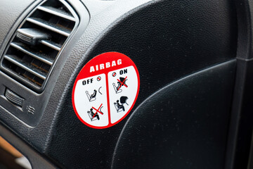 Closeup of an airbag instructions sticker, air bag safety practices symbol guide for a child seat...