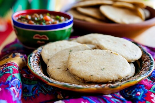 Picadas Veracruz traditional breakfast food rich in fiber and iron from corn masa and salsa shown in authentic setting