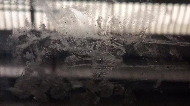 capturing the brilliant, reflective, and often magical effects that occur when light shines through or bounces off glass surfaces