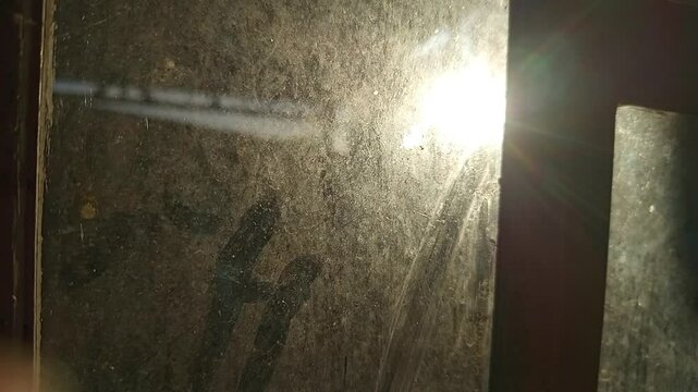 capturing the brilliant, reflective, and often magical effects that occur when light shines through or bounces off glass surfaces