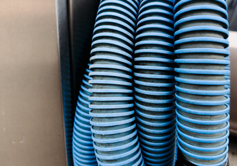 Close-Up of Blue Industrial Vacuum Hose – Flexible Corrugated Pipe for Heavy-Duty Use