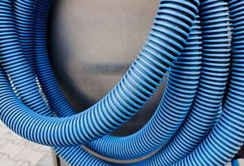 Close-Up of Blue Industrial Vacuum Hose – Flexible Corrugated Pipe for Heavy-Duty Use