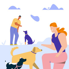 Man and woman training commands with dogs, playing with puppies