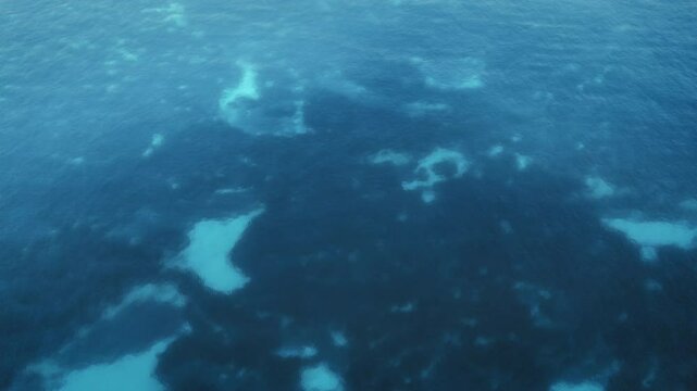 Aerial view of underwater reef patterns beneath the Ionian Sea in summer