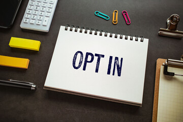 There is notebook with the word Opt in. It is as an eye-catching image.