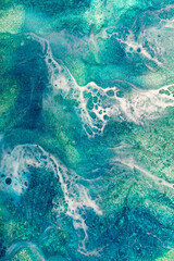 Macro Blue green and white resin with sparkles background