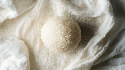 A Single Rice Ball on a White Cloth