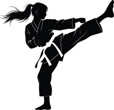 Silhouette of a female karateka performing a powerful high kick in martial arts training