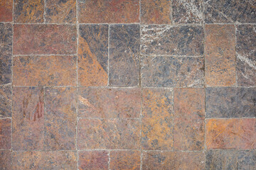 Fototapeta premium Rustic stone tile surface with natural texture and earth tones