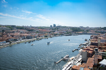 View over River Douro in Portugal, with Porto on the right, and Vila Nova de Gaia on the left. Wide...