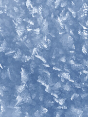 Background of winter snow texture. Small ice crystals on surface of snow natural background