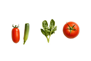 Four fresh vegetables a plum tomato, zucchini, spinach, and a large tomato, arranged horizontally against a black background