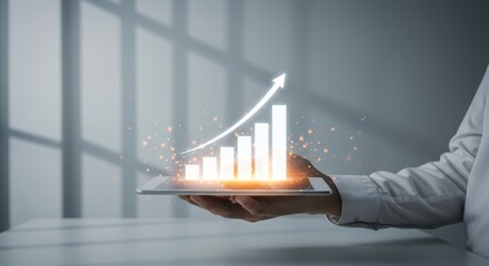 Business person holding futuristic tablet displaying financial graph for corporate growth and success