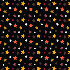 Colorful stars seamless pattern on dark background.