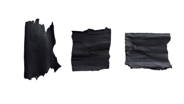 Three dark gray, irregularly torn pieces of matte paper or tape, arranged horizontally against a black background