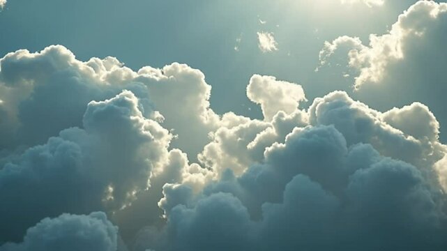 A breathtaking view of a partly sunny sky filled with fluffy cumulus clouds, illuminated by the sun's radiant glow, creates a dramatic and serene atmosphere.