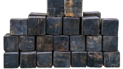 A pyramid of dark, rectangular, aged wooden blocks, showing texture and wear, stacked neatly
