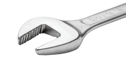 Close-up of a metallic wrench, showing its jaws and textured handle.  The tool appears well-used but in good condition