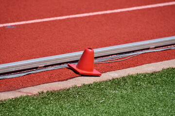Red Cone on a Sports Track