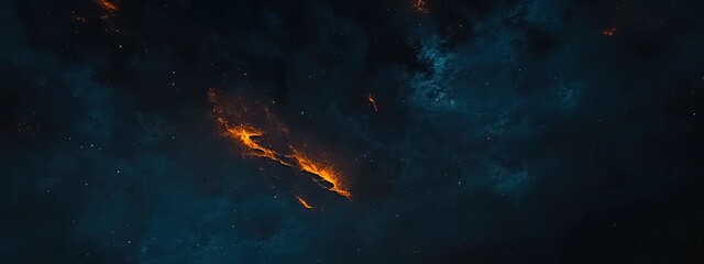 Obraz premium A dark, starry sky with swirling blue clouds and a glowing orange streak of light in the center