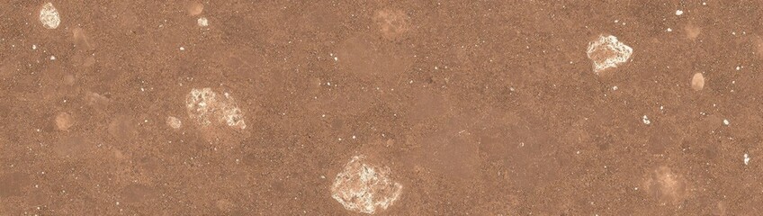 A close-up of a brown surface with white specks