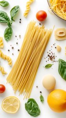 Italian Spaghetti, Tomato, Lemon, and Basil Leaves on a White Background CloseUp