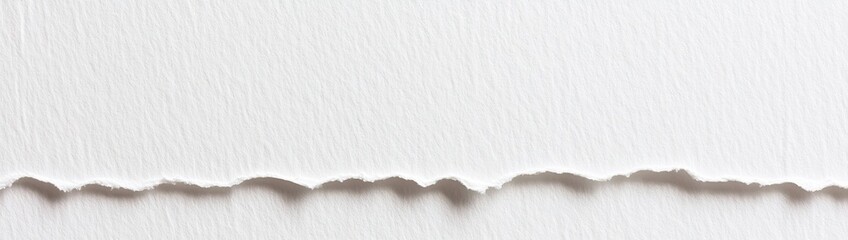 A white textured surface with a torn edge