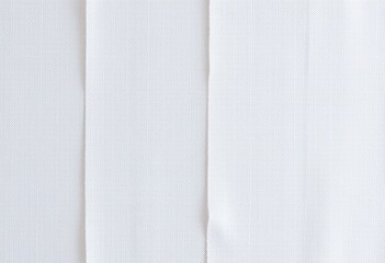 Close-up view of a white fabric texture.