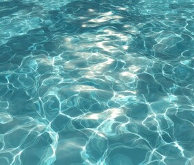 Obraz premium Calm turquoise water surface with subtle ripples and shimmering sunlight reflections