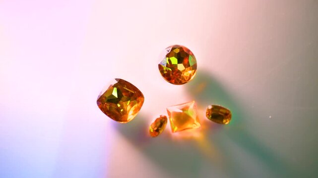 gemstones on a white table in multicolor illumination